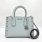 Cartera Michael Kors celeste tachas saffiano