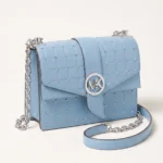 Cartera Michael Kors celeste con tachas