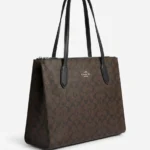 Tote Coach Signature marron con asas negras