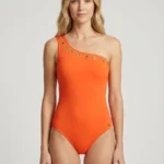 Traje de baño naranja de un hombro con ojales dorados